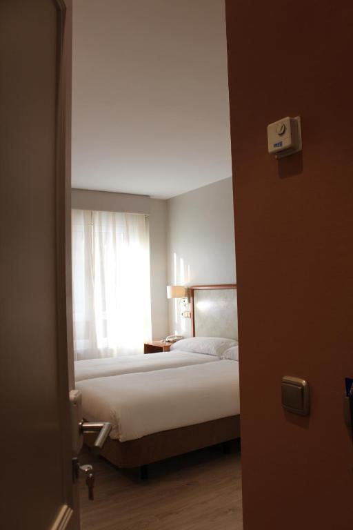 Postel nebo postele na pokoji v ubytování Hotel Carreño