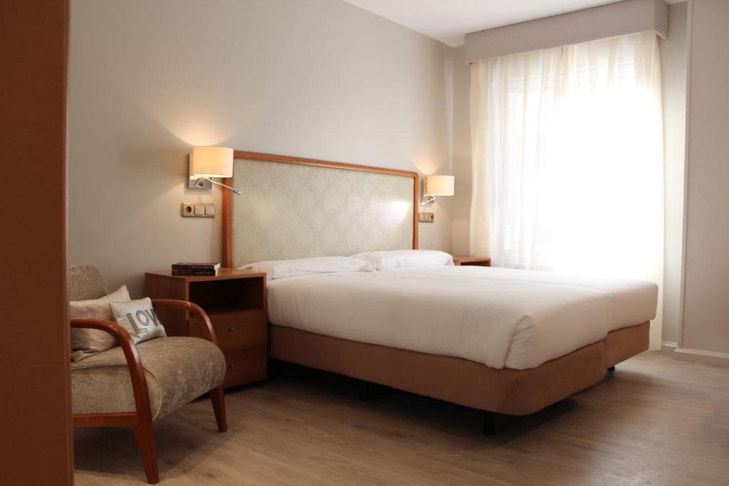 Postel nebo postele na pokoji v ubytování Hotel Carreño