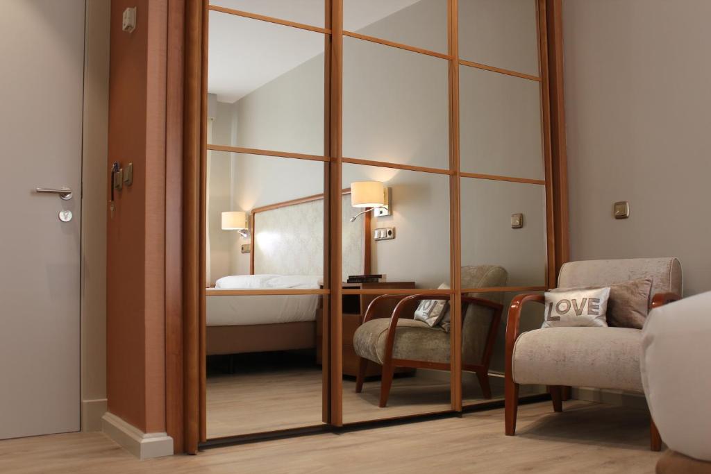Postel nebo postele na pokoji v ubytování Hotel Carreño