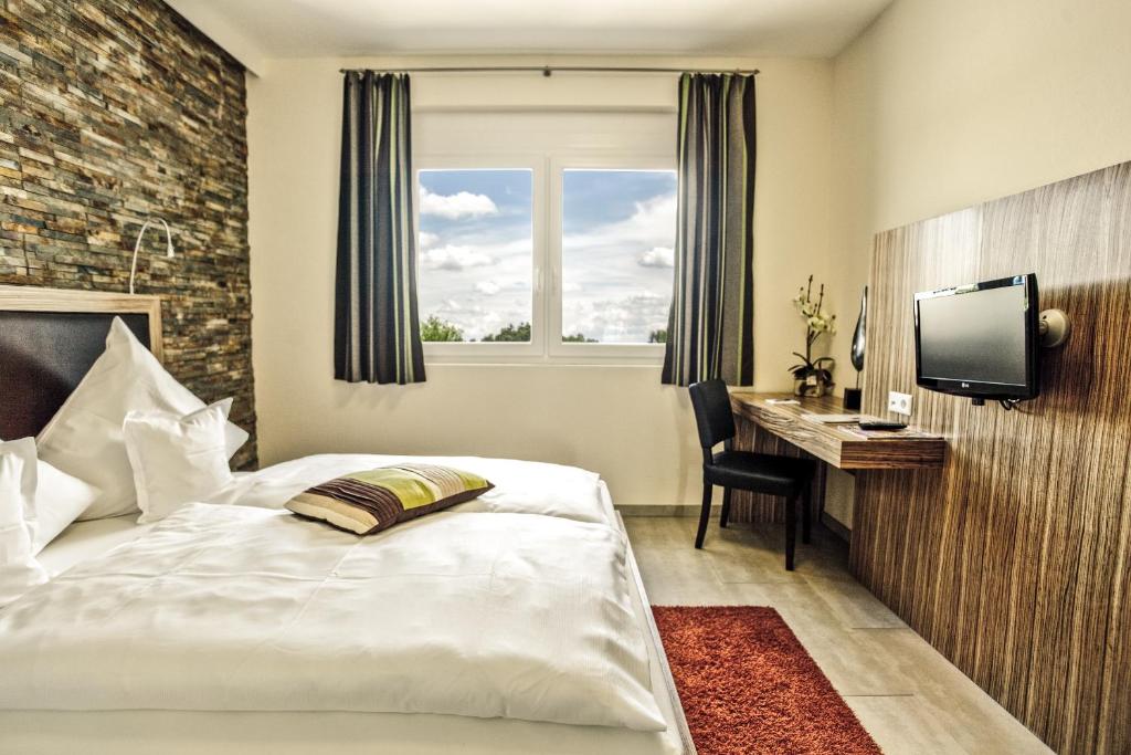 Postel nebo postele na pokoji v ubytování Hotel Maxis - digitaler Self-check-in -
