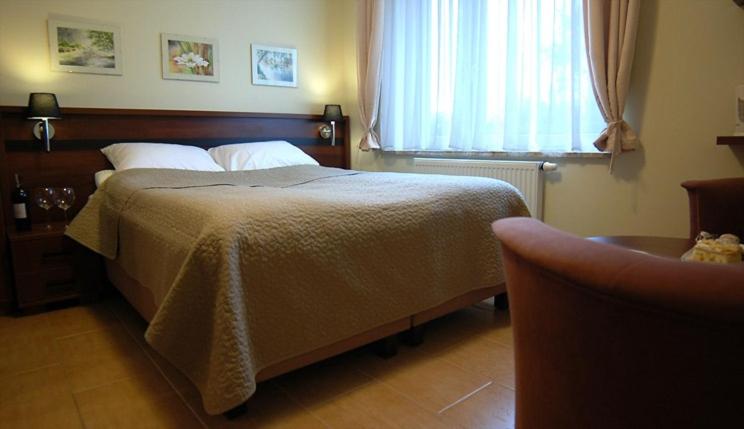 Postel nebo postele na pokoji v ubytování Willa Horyzont