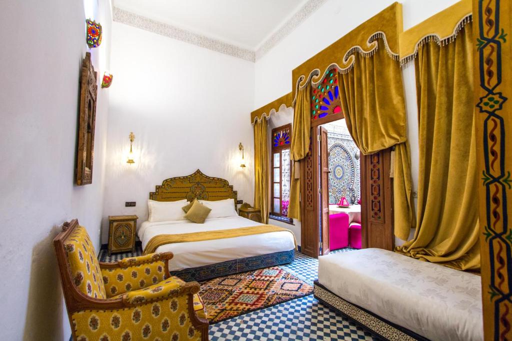 Postel nebo postele na pokoji v ubytování Riad Dar Bab Guissa