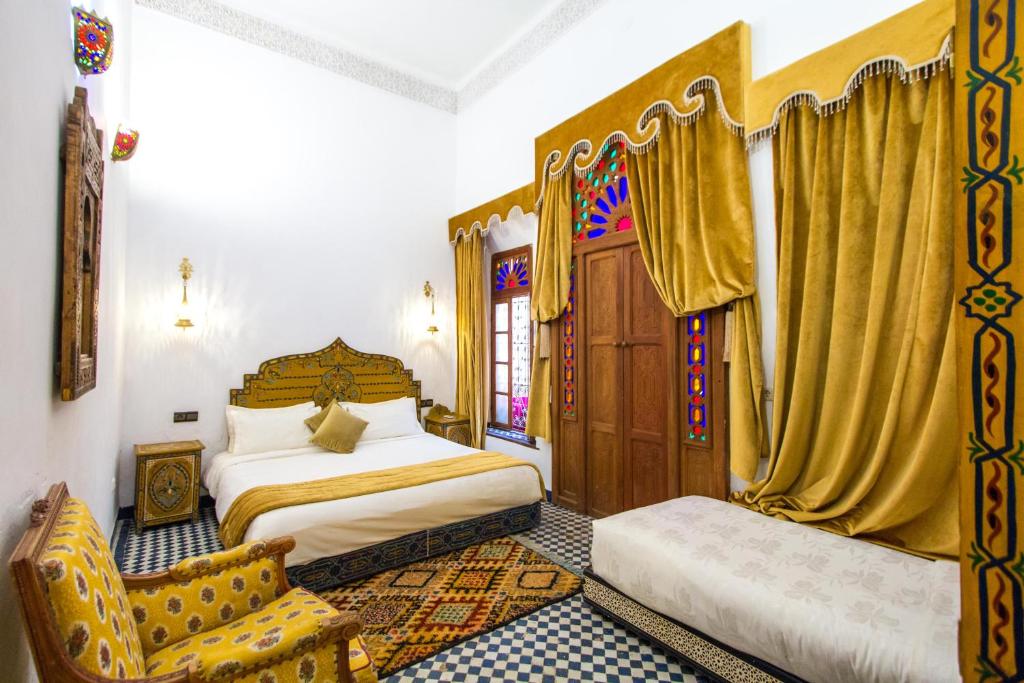 Postel nebo postele na pokoji v ubytování Riad Dar Bab Guissa