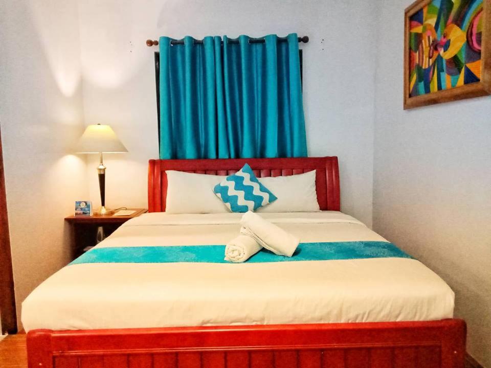 Postel nebo postele na pokoji v ubytování Discover Boracay Hotel