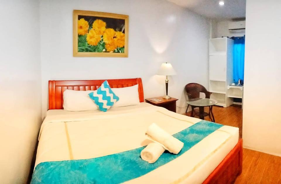 Postel nebo postele na pokoji v ubytování Discover Boracay Hotel