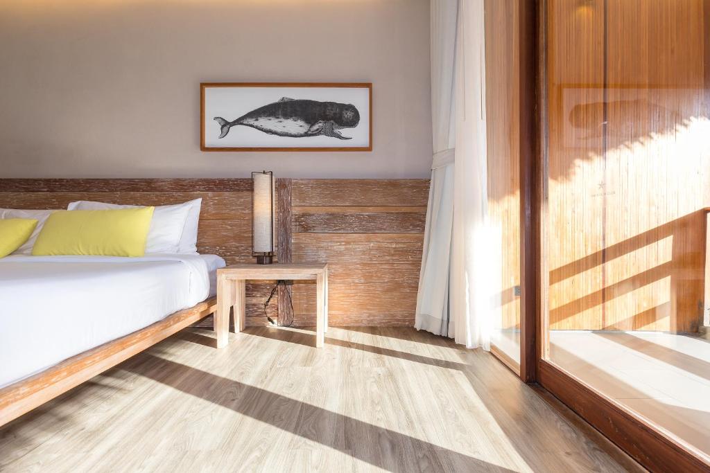 Postel nebo postele na pokoji v ubytování Beach Club by Haadtien