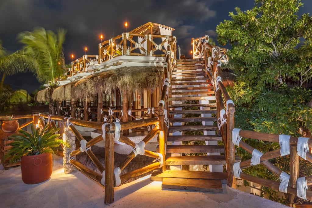 a staircase leading up to a resort at night at Hotel Para Ti - Adults Only in Holbox Island