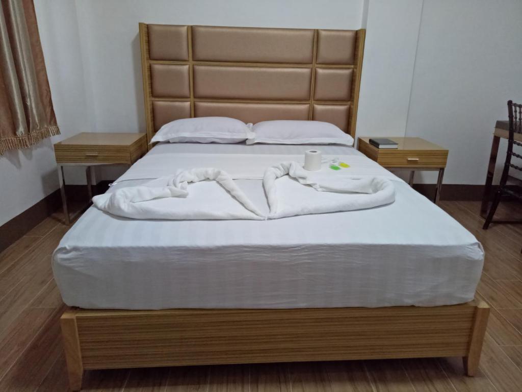 Postel nebo postele na pokoji v ubytování Meaco Hotel - Anilao