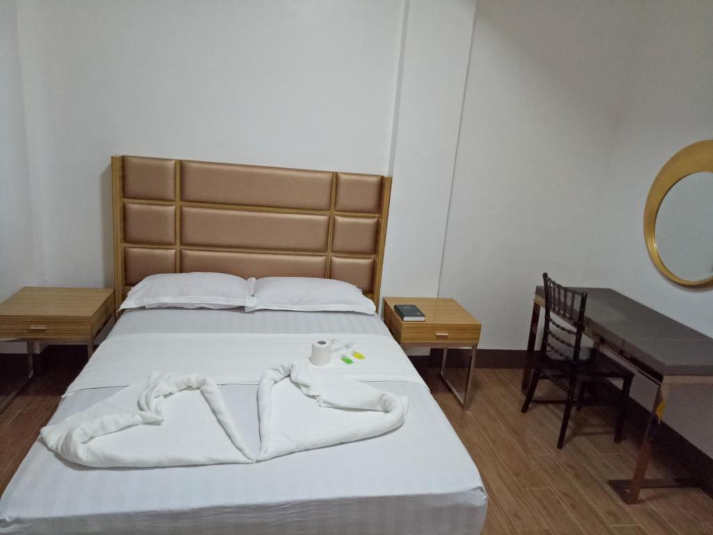 Postel nebo postele na pokoji v ubytování Meaco Hotel - Anilao