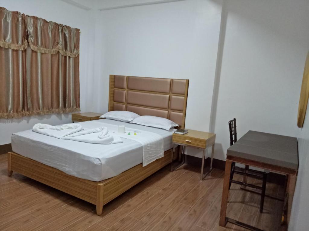 Postel nebo postele na pokoji v ubytování Meaco Hotel - Anilao