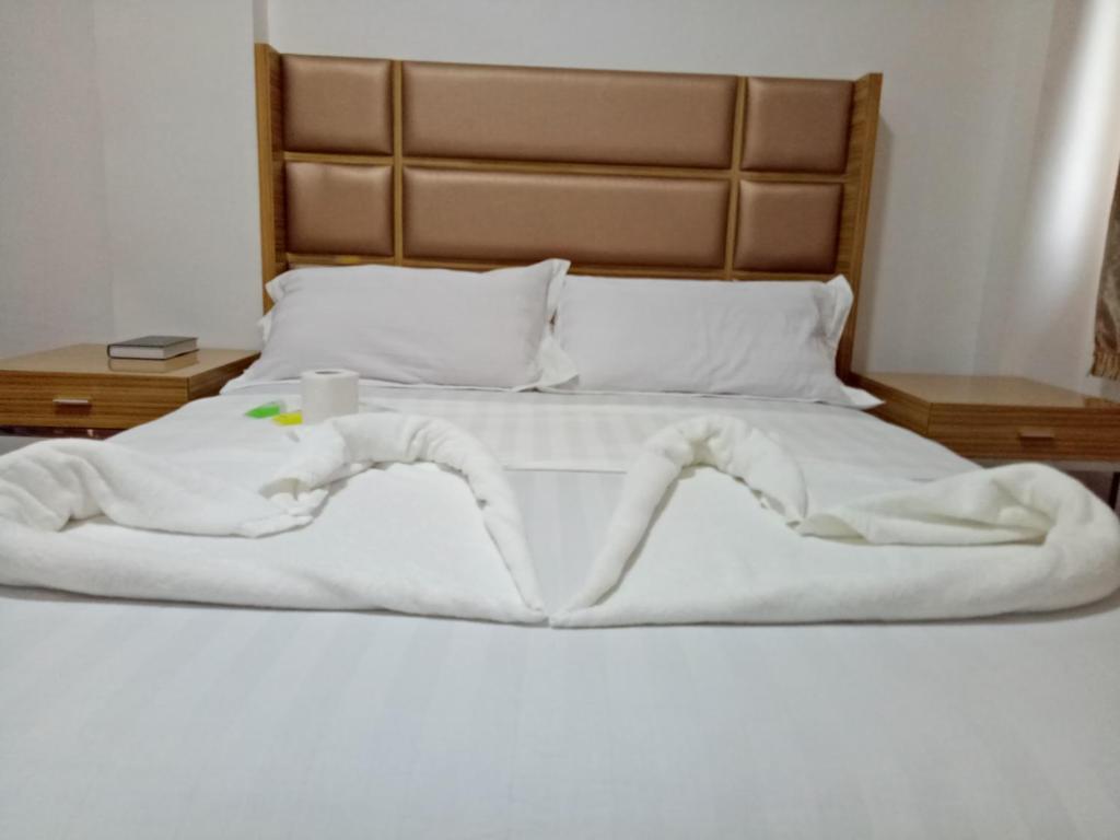 Postel nebo postele na pokoji v ubytování Meaco Hotel - Anilao