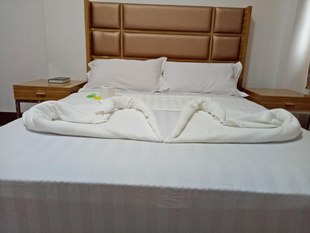 Postel nebo postele na pokoji v ubytování Meaco Hotel - Anilao