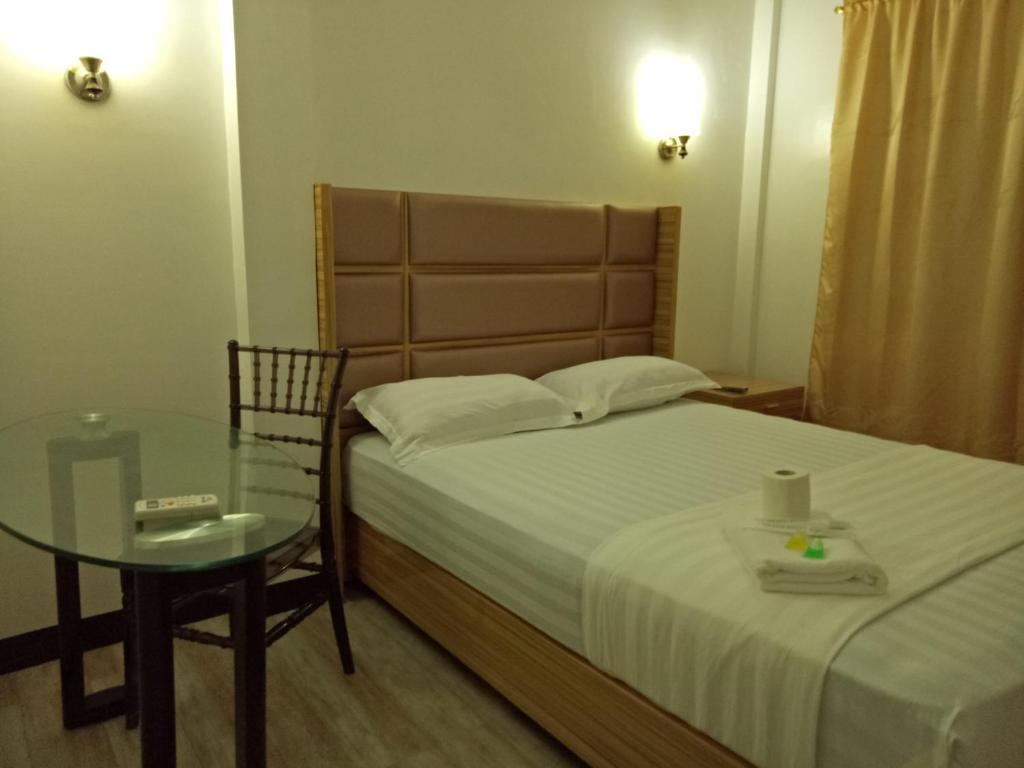 Postel nebo postele na pokoji v ubytování Meaco Hotel - Anilao
