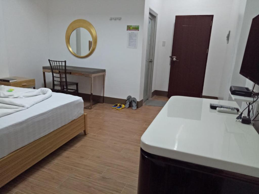 Postel nebo postele na pokoji v ubytování Meaco Hotel - Anilao