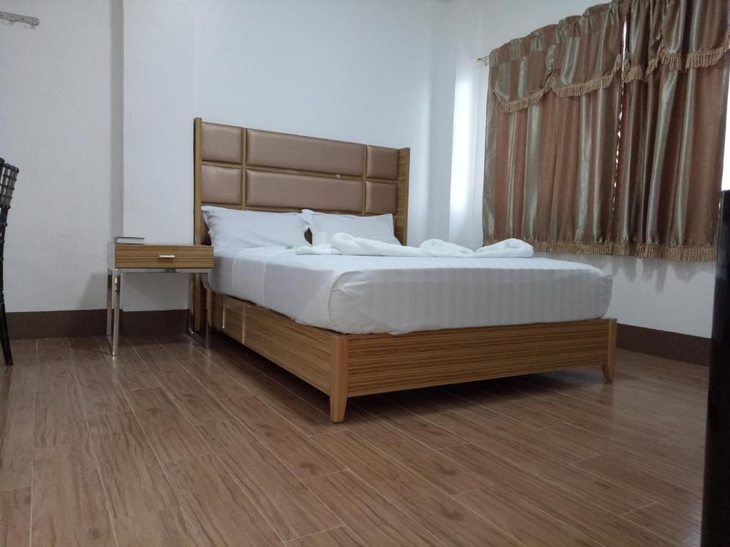 Postel nebo postele na pokoji v ubytování Meaco Hotel - Anilao