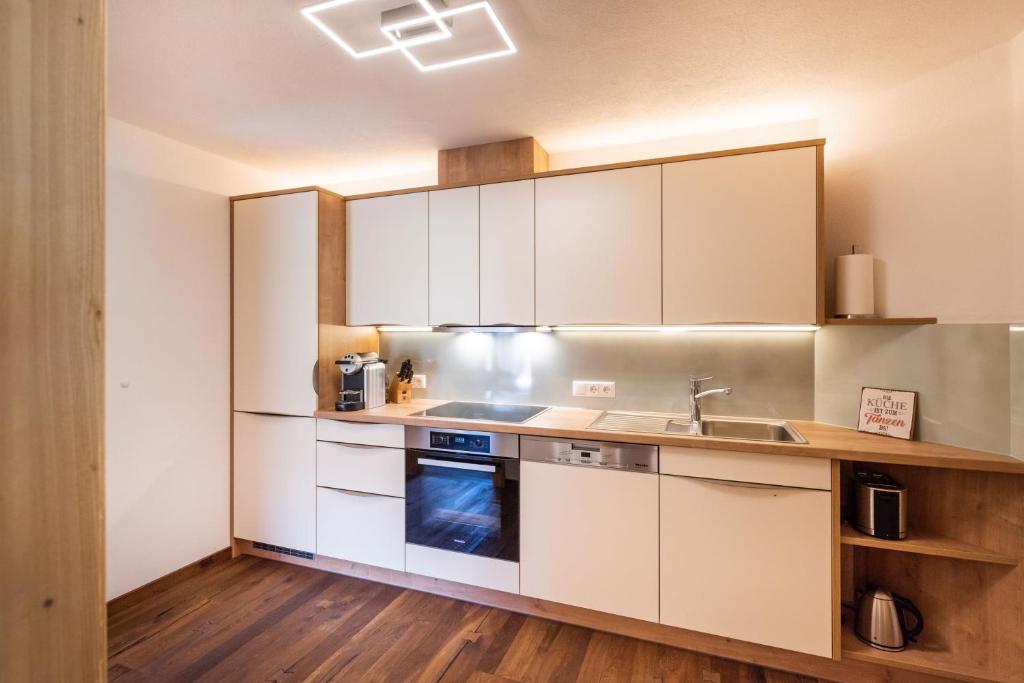 Kuchyň nebo kuchyňský kout v ubytování Viktoria Lodges