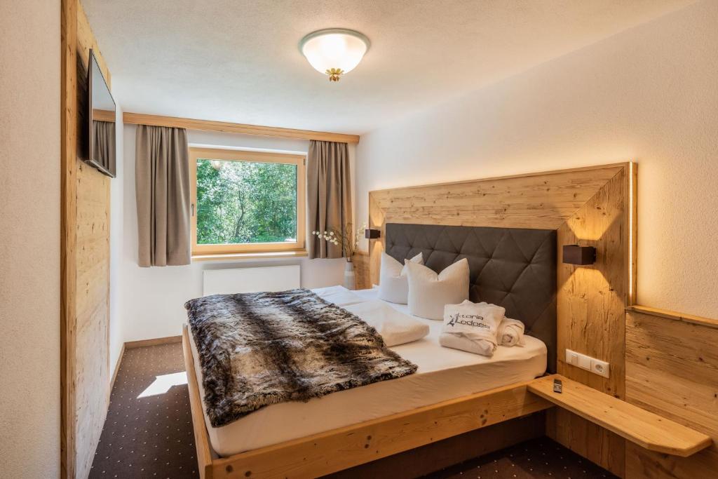 Postel nebo postele na pokoji v ubytování Viktoria Lodges
