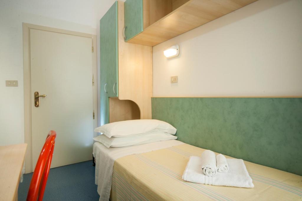 Postel nebo postele na pokoji v ubytování Hotel Erika