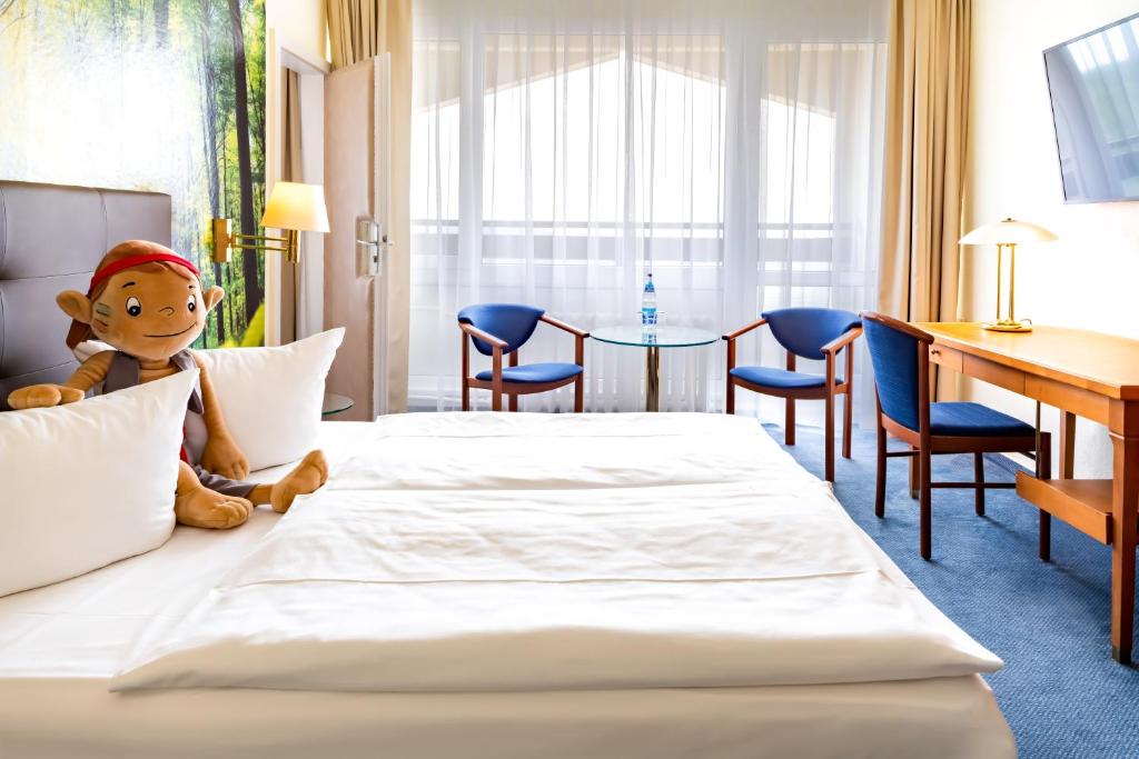 Postel nebo postele na pokoji v ubytování AHORN Berghotel Friedrichroda