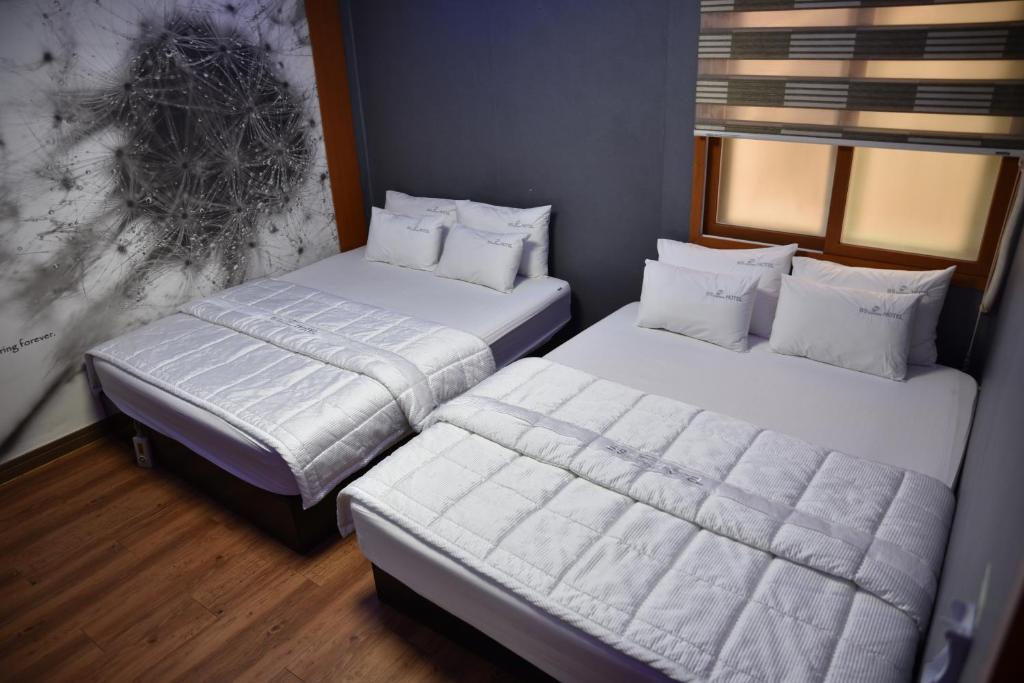 Postel nebo postele na pokoji v ubytování Business Hotel Busan Station