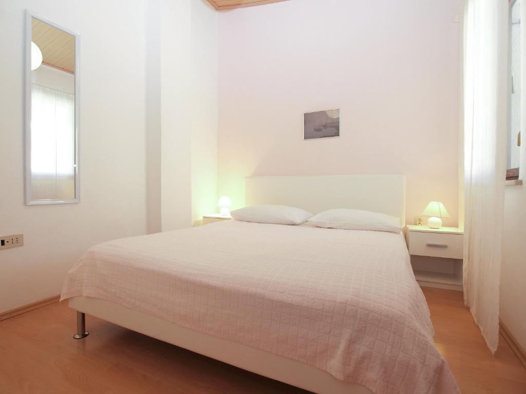 Posteľ alebo postele v izbe v ubytovaní Apartments Peroj 959