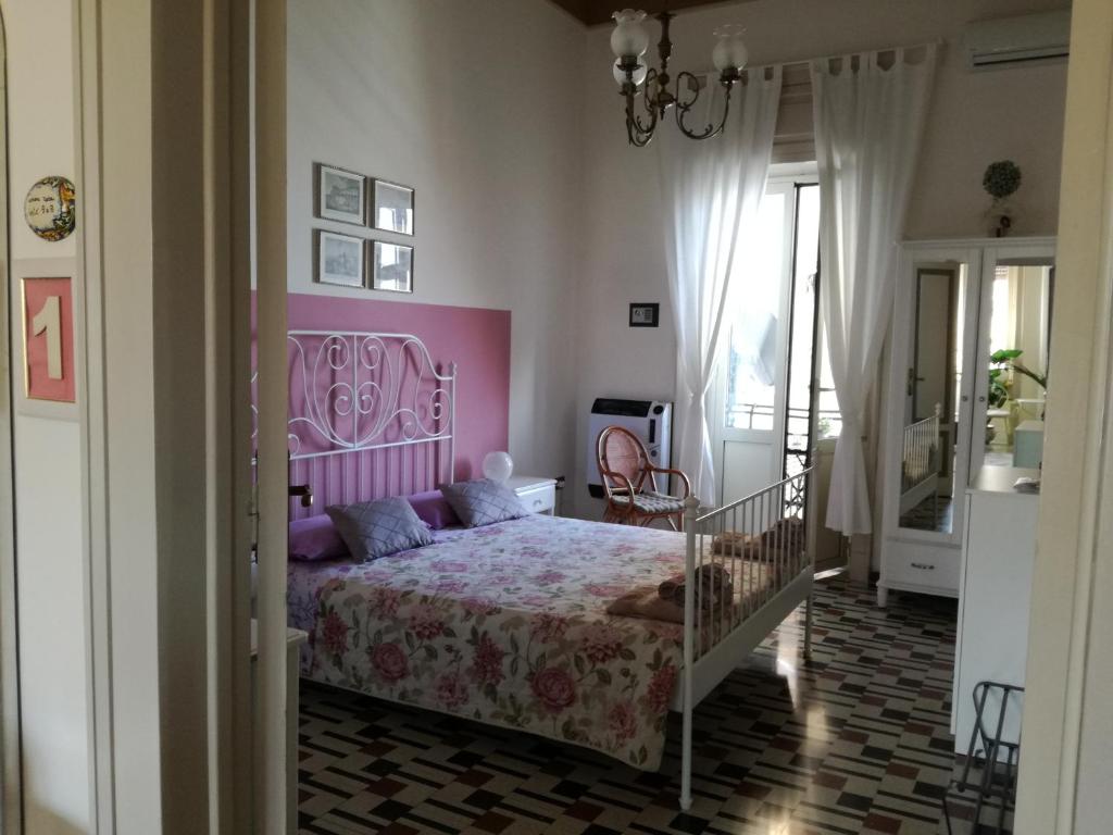 Postel nebo postele na pokoji v ubytování Aretè Guest House