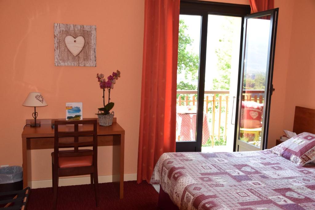 Postel nebo postele na pokoji v ubytování Hotel Bellevue
