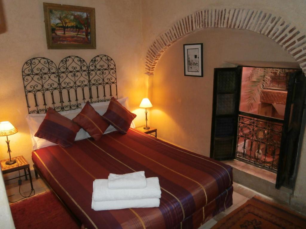 Postel nebo postele na pokoji v ubytování Riad N10