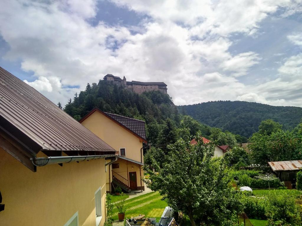 a view of a castle on top of a mountain at Apartmán 80 in Oravský Podzámok
