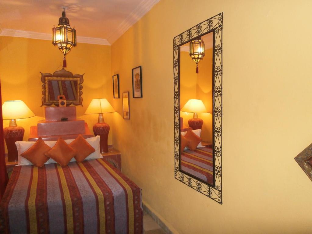 Postel nebo postele na pokoji v ubytování Riad N10