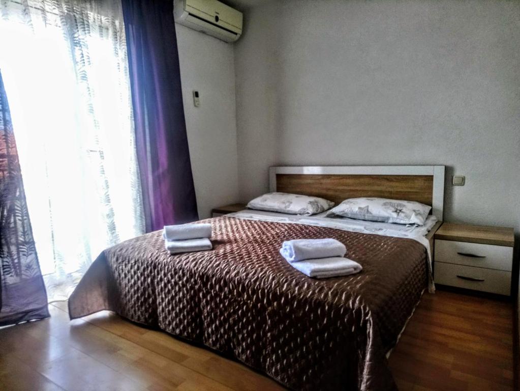 Postel nebo postele na pokoji v ubytování Apartmani Five
