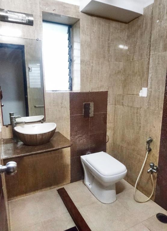 Koupelna v ubytování Tatvam Residency