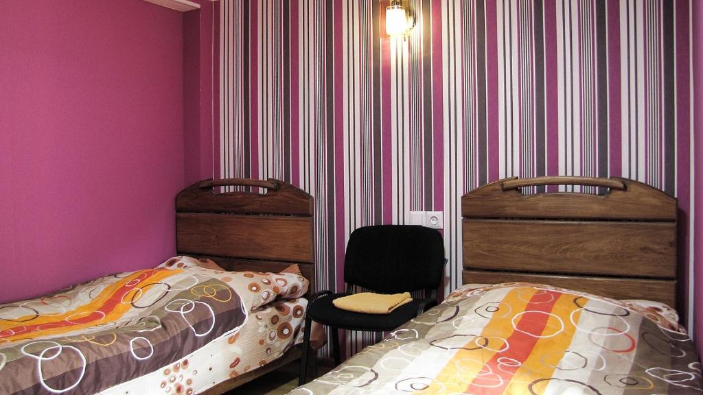 Postel nebo postele na pokoji v ubytování Ushguli Panorama Guest House