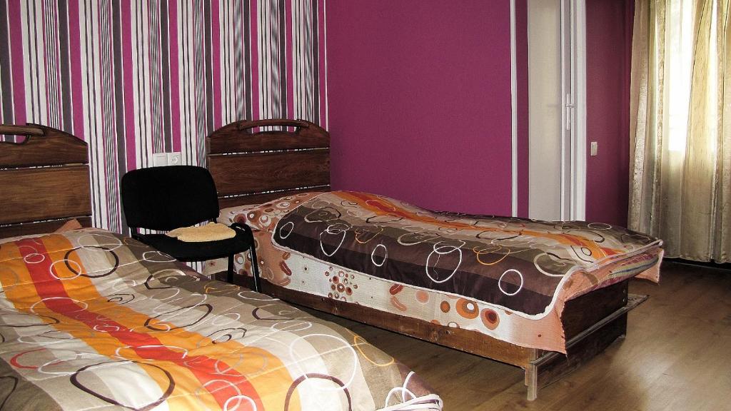 Postel nebo postele na pokoji v ubytování Ushguli Panorama Guest House