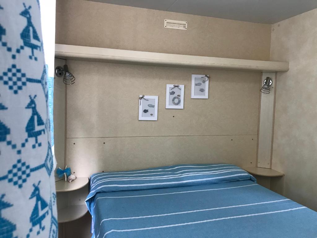 Postel nebo postele na pokoji v ubytování Camping Car Palmasera