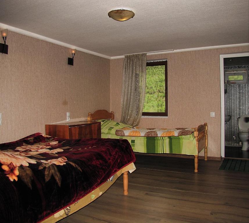 Postel nebo postele na pokoji v ubytování Ushguli Panorama Guest House