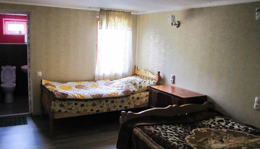 Postel nebo postele na pokoji v ubytování Ushguli Panorama Guest House