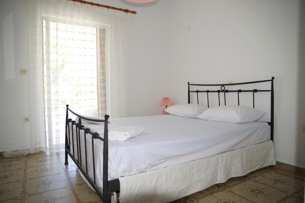 Postel nebo postele na pokoji v ubytování Kavos Central gardens