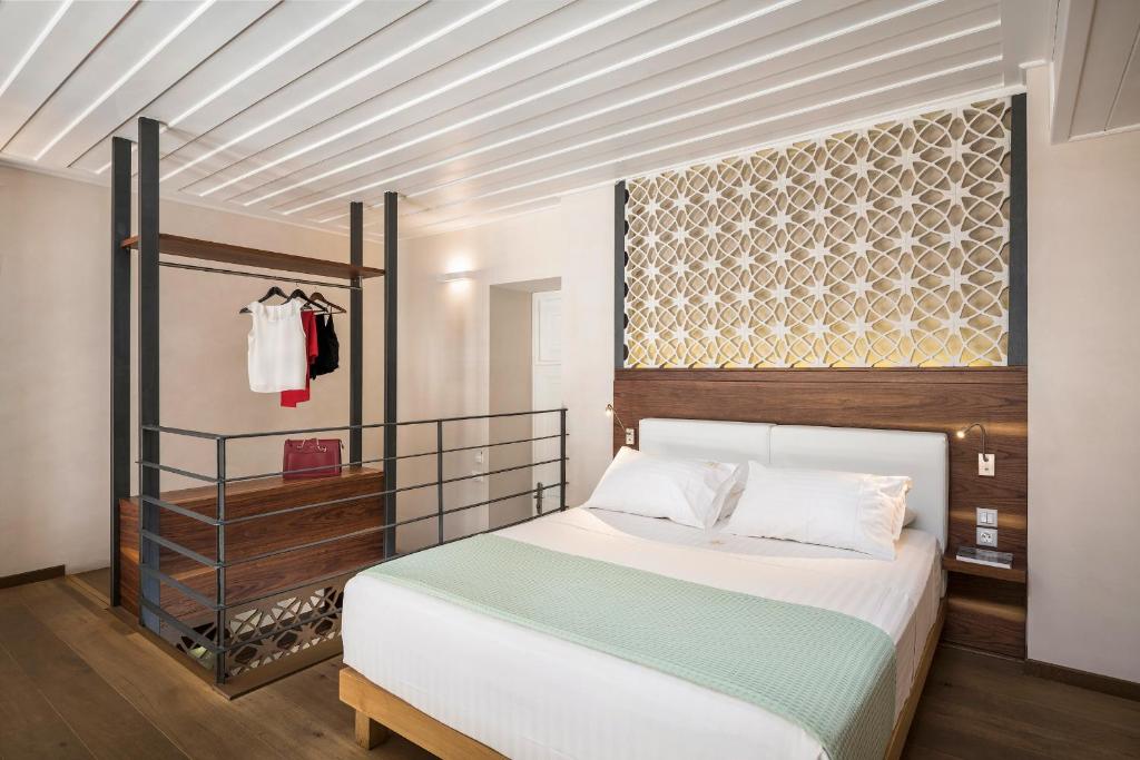 Posteľ alebo postele v izbe v ubytovaní Ambassadors Residence Boutique Hotel