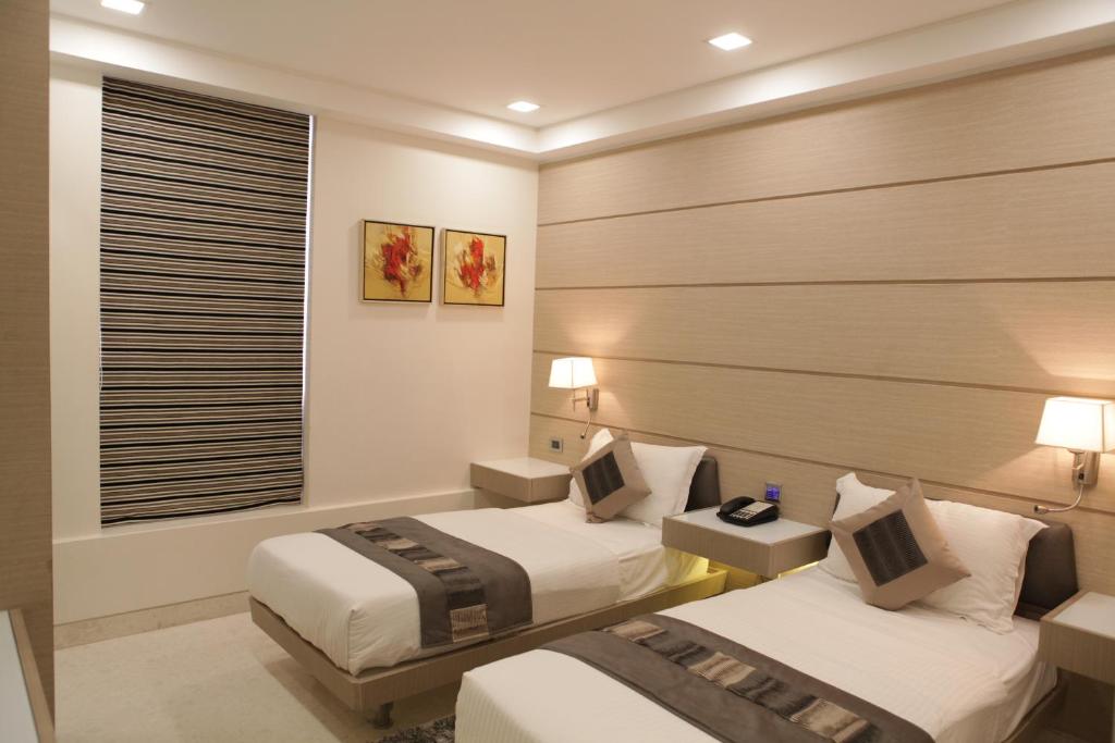 Postel nebo postele na pokoji v ubytování Residency Hotel Fort