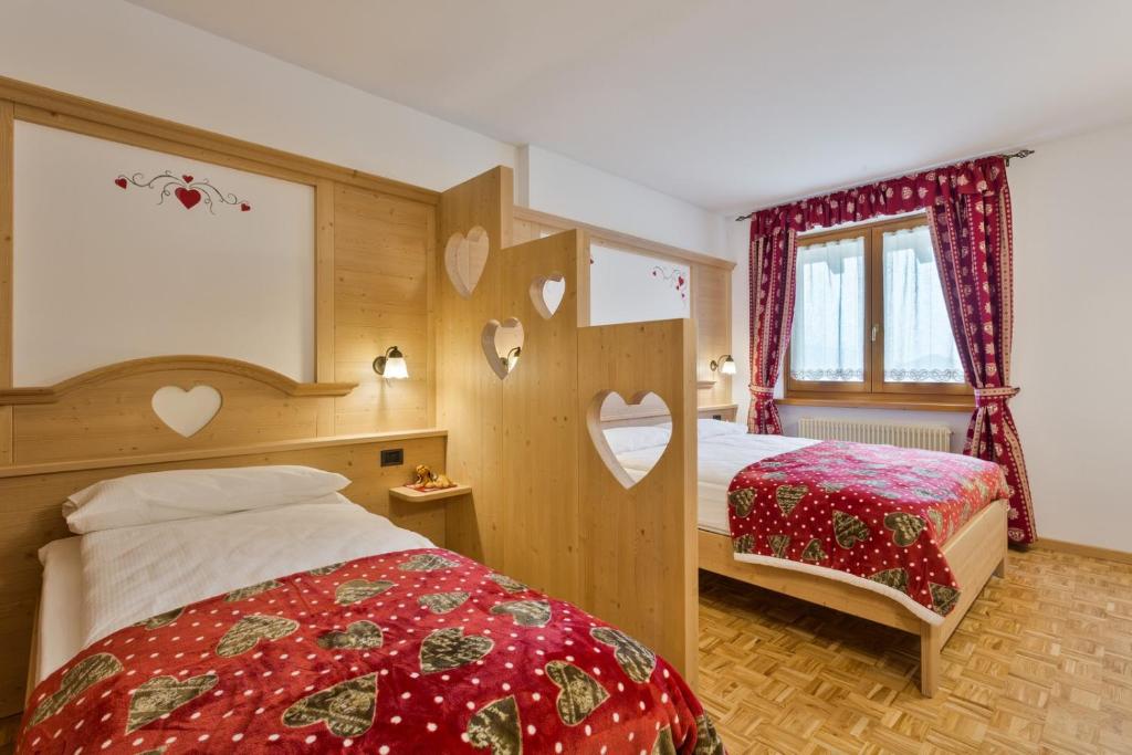 Postel nebo postele na pokoji v ubytování Residence Ronchi