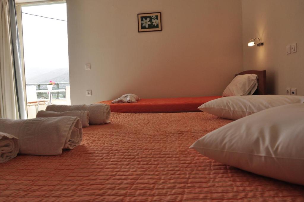 Postel nebo postele na pokoji v ubytování Ostria Hotel