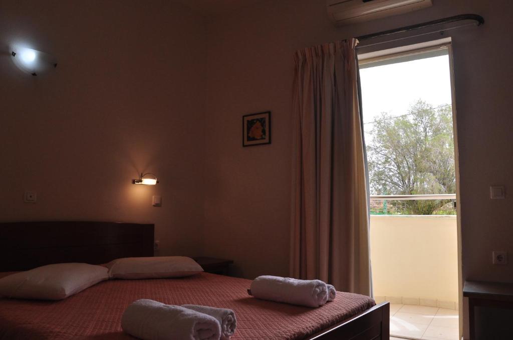Postel nebo postele na pokoji v ubytování Ostria Hotel