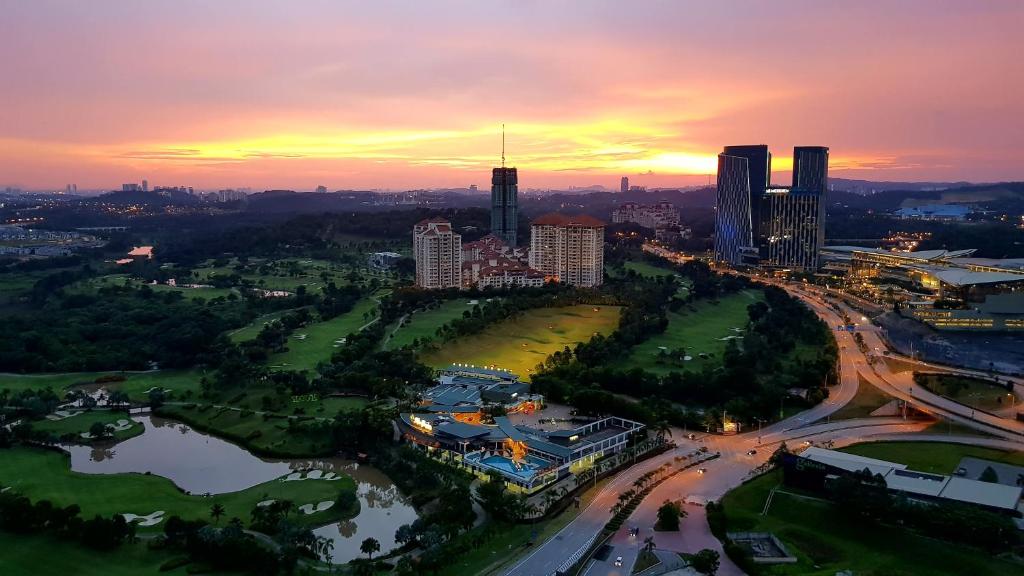 an aerial view of a city at sunset at IOI Golf Suite in Putrajaya