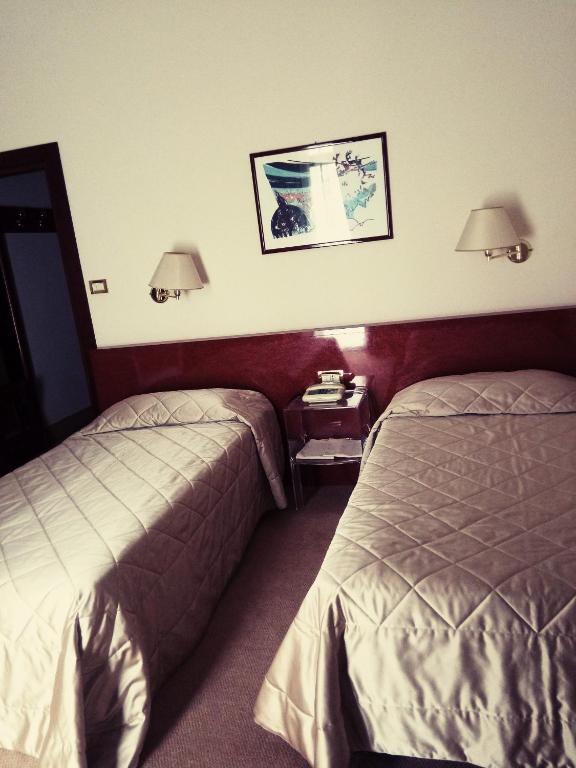 Postel nebo postele na pokoji v ubytování Ermitage Bel Air Medical Hotel