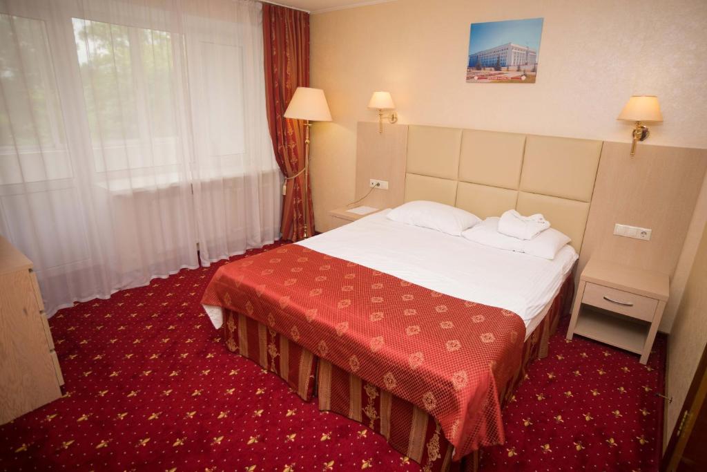 Cama o camas de una habitación en AMAKS City-Hotel