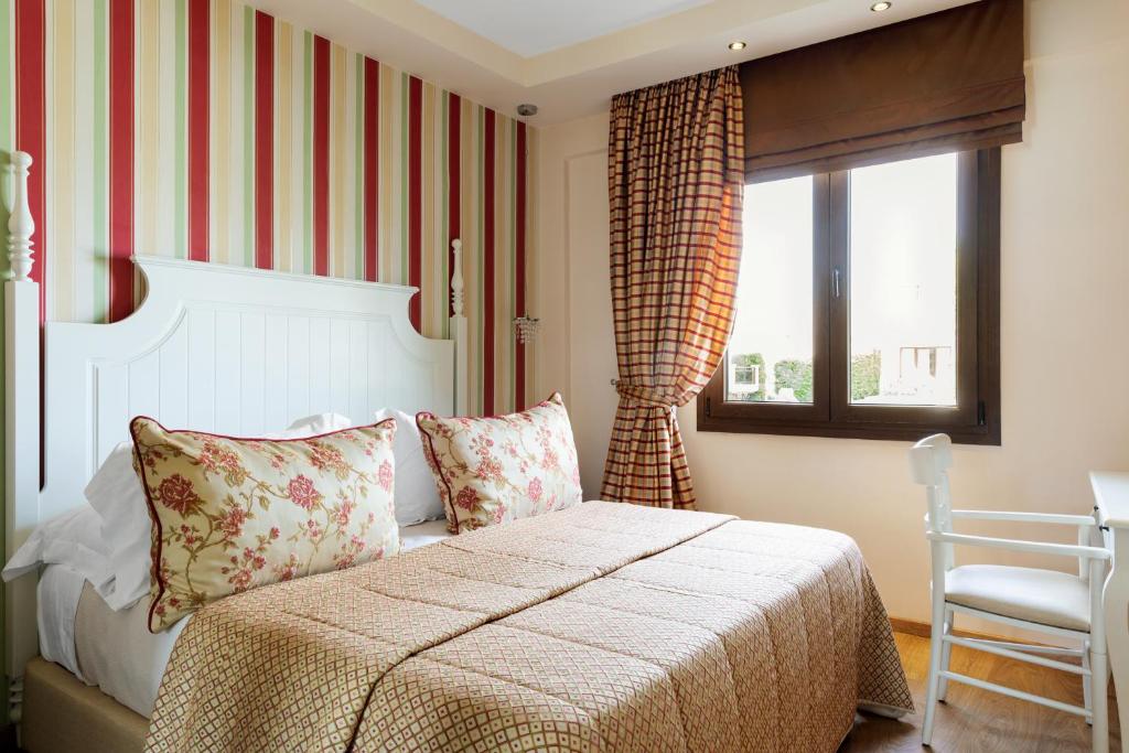 Postel nebo postele na pokoji v ubytování Mediterranean Village Hotel & Spa
