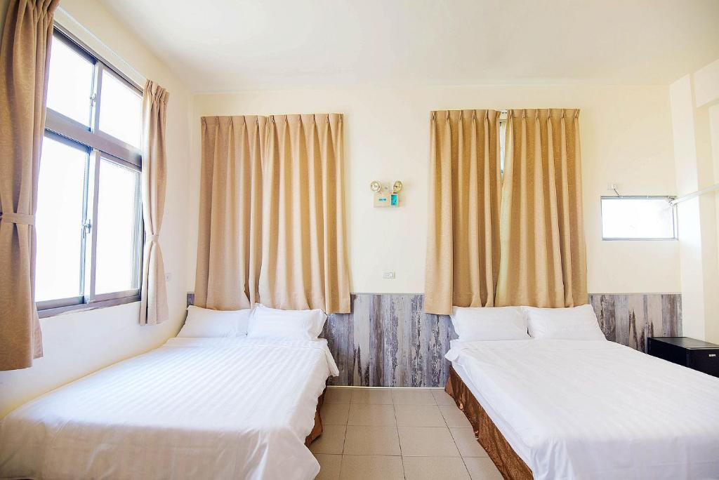 Postel nebo postele na pokoji v ubytování Happiness B&B