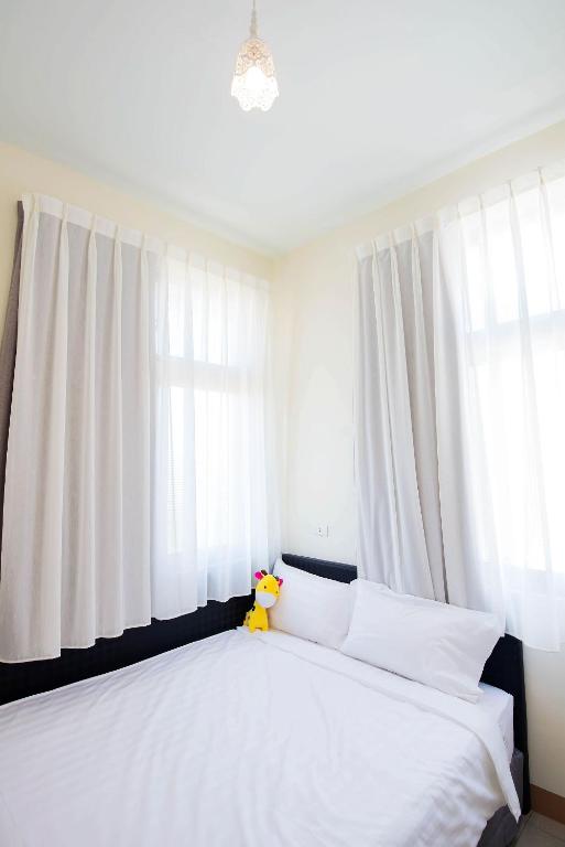 Postel nebo postele na pokoji v ubytování Happiness B&B