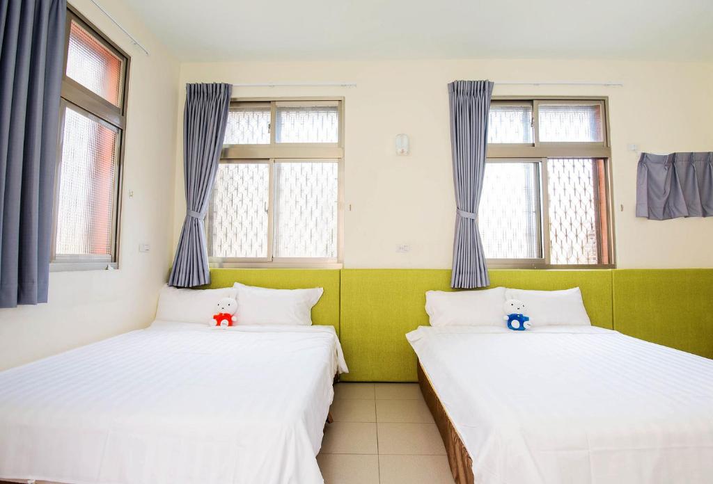 Postel nebo postele na pokoji v ubytování Happiness B&B